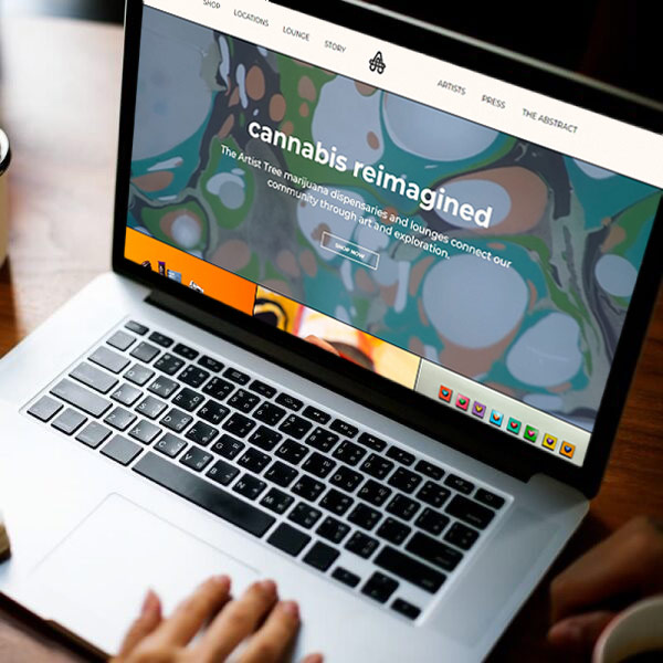 Computer with The Artist Tree website on it